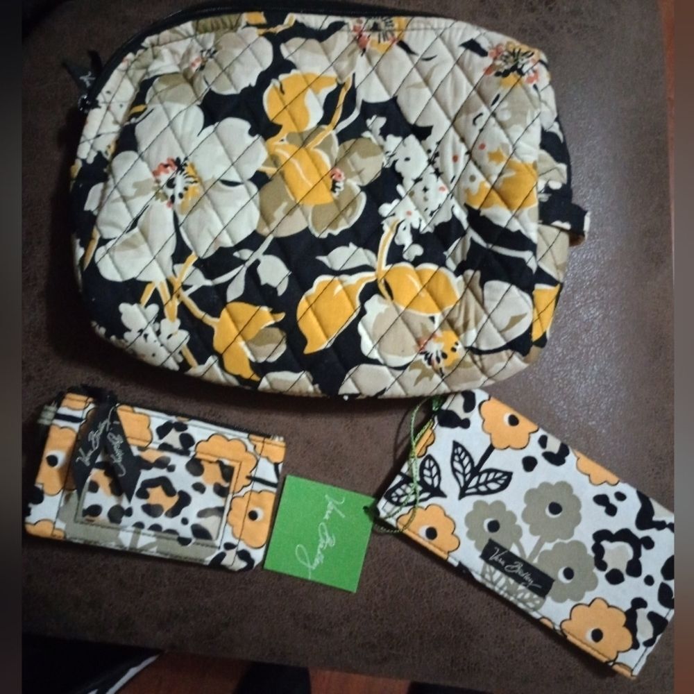 Vera Bradley triple set, checkbook cover, change purse, and bag. Like new.